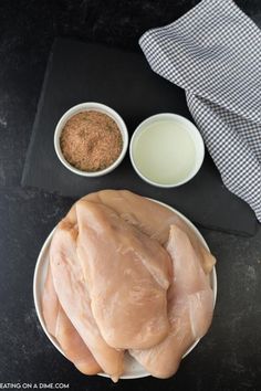 raw chicken and other ingredients on a plate