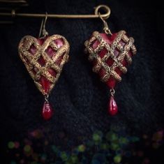 Gothic earrings Heart in a golden net with a drop of blood Collection Love and Blood Where drops of blood fall, red poppies will grow and bloom on the longest summer day...  These earrings are molded entirely by hand from polymer clay. Hearts and drops of blood imitate translucent glass, braided with imitation old gold metal mesh.  Decorative element length 45 mm Width 30 mm Weight of one earring 7g Sold in a wooden box Clay Hearts, Translucent Glass, Gothic Earrings, Earrings Heart, Costume Cosplay, Metal Mesh, Fantasy Jewelry, Red Poppies, Wooden Box