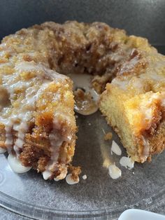 a cake that has been cut in half and is on a plate with icing