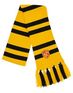 Bundle up for your next trip to Weasleys’ Wizard Wheezes for your favorite magical gifts! This officially licensed yellow and black striped knit scarf features Hufflepuff’s signature house crest and dangling fringe ends. Officially licensed Material: Acrylic Care: Hand wash Imported Weasleys Wizard Wheezes, Hufflepuff Scarf, Wizard Wheezes, Magical Gifts, Magical Gift, Yellow And Black, S Signature, Spirit Halloween, Striped Knit