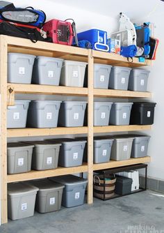 the shelves are filled with plastic storage bins