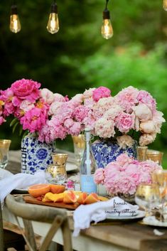 a table topped with lots of pink flowers