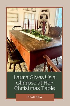 a wooden table with candles on it and the words, lauren gives us a glimpse at her christmas table read now