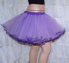 "The main fabric is soft Pastel Purple Lavender Bridal Tulle. The waistband is dark purple cotton over elastic. Then I finished it off with more purple piping on the hem. This skirt is stitched and serged to last a lifetime. It's safe for the washing machine and the dryer. Measurements: Waist Size Small: 24\" to 32\" Medium: 33\" to 42\" Large: 42\" to 50\" Length: 14\" NOTE This listing is only for the Purple piped tulle skirt. The matching cotton circle skirt is NOT included, but available in Lavender Tutu Skirt, Tulle Costume, Tulle Costumes, Costume Tutu, Crinoline Skirt, Colorful Birthday Party, Tutu Costumes, Purple Skirt, Color Run