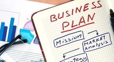 a business plan is shown on a notebook