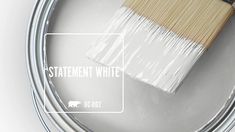 a paint can with a brush in it and the words, painter's white