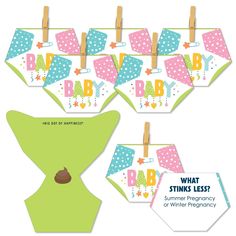 baby shower decorations with clothes hanging from the clothes line and an image of a teddy bear