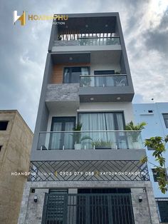 an apartment building with balconies on the second floor