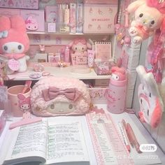 a room filled with lots of pink stuff animals and toys on top of a table