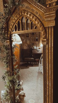 an arch in the middle of a living room with potted plants on the floor