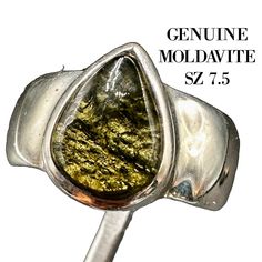 Elevate your spiritual journey with our exquisite Moldavite Crystal Ring, a harmonious blend of ancient cosmic energy and timeless elegance. Set in high-quality sterling silver AND the higher polished moldavite grade, this size 7.5 ring showcases a polished Moldavite crystal, meticulously crafted to highlight its natural beauty and potent metaphysical properties. 6.5 grams of high grade certified natural moldavite Moldavite: A Gift from the Stars Formed over 15 million years ago from a meteorite Moldavite Crystal, Cosmic Energy, Healing Crystal Jewelry, Crystal Ring, Men's Ring, Crystal Rings, Spiritual Journey, Healing Crystal, Spiritual Growth