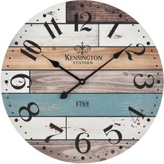 a clock made out of wood with the words kensingtonton station on it's face