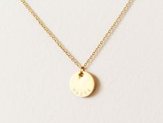 Elevate your style with our personalized Curved Name Necklace, a must-have accessory for everyday wear and seamless layering. This stunning engraved necklace is meticulously hand-stamped and exudes elegance, making it the perfect gift for yourself, loved ones, bridesmaids, or weddings. Each item is expertly crafted and personalized, offering a meaningful touch to your jewelry collection. Made from tarnish-resistant stainless steel, our materials ensure long-lasting beauty. Customize the charms with a single symbol or up to seven characters (letters or numbers) to create a truly unique piece. The necklace hangs elegantly from a 16-inch chain with a 2-inch extender. It comes ready to be gifted on a jewelry card. Materials: - Hypoallergenic stainless steel chain  - Stamped stainless steel dis Minimalist Engraved Jewelry For Bridesmaid Gift, Initial Birthstone Necklace, Date Necklace, Name Necklace Gold, Jewelry Card, Custom Name Necklace, Engraved Necklace, Personalized Initials, Stunning Necklace