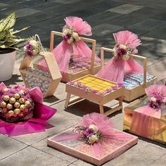 pink and gold decorations sit on the ground