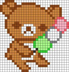 a cross stitch pattern with a teddy bear holding a green object in it's mouth