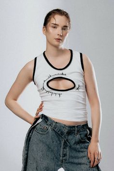 White tank top with black trimming and an embroidery pattern surrounding cut-out chest.COMPOSITION: 100% COTTON Edgy White Tank Top For Spring, Edgy Racerback Tank Top For Spring, Embroidery Pattern, White Tank Top, White Tank, Embroidery Patterns, Cut Out, Composition, Tank Top