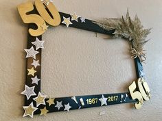 a 50th birthday photo frame decorated with stars