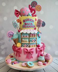 a colorful cake with lots of candies and lollipops