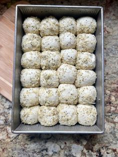 a pan filled with balls of food on top of a counter