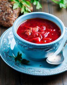 a bowl of soup on a blue plate