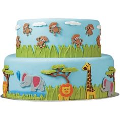 a three tiered cake decorated with animals and giraffes on blue icing