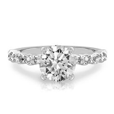 The Clara ring features stunning marquise and round diamonds that go halfway down the band, and a sparkling hidden halo of pavé diamonds just under the girdle of the center stone. The diamonds along the band are held by shared prongs, adding stability to this dainty style. The Clara engagement ring is designed to match perfectly with the Clara Band. Dainty Style, Round Diamond Ring, Diamond Guide, Radiant Cut Diamond, Hidden Halo, The Band, Gold Platinum, Lab Created Diamonds, Lab Diamonds