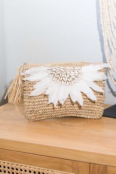 "Introducing our stunning Boho Purse, handmade with love from natural raffia. This purse is the perfect accessory for your summer outfits, giving them a delightful tropical flair. Its intricate weaving and earthy tones effortlessly blend with any ensemble, making it a versatile must-have for your bohemian-inspired wardrobe. With its spacious interior and sturdy construction, this purse is not only stylish but also practical. Embrace the warm vibes of the season and elevate your look with this delightful Boho Purse. ● Material: Natural raffia Grass, Feathers, Cowrie shells, Calico lining, Metal zipper ●Quantity listed: 1pc ●Dimension: 30 x 20 cm ~ 11.8\"x7.8\"  - Do not WASH PACKING ● will be wrapped with white paper then bubble wrap then poly mailer reusable plastic. SHIPPING  Processing t Raffia Purse, Bohemian Clutch, Boho Clutch, Boho Purse, Wedding Bags, Chic Summer Outfits, Handmade Clutch, Purse Handmade, Crystal Bags