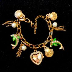 Beautiful Beachy Dangling Charms On A Bracelet With Strada Heart Watch. There’s Faux Pearls Shells And Dolphins Goldtone Link Bracelet Thats Adjustable Up To 9” Nwt Still Has Clip In For Battery And Tag On Back Travel Charm Bracelet, Heart Watch, Travel Charms, Cute Nike Shoes, Watch Bracelet, A Bracelet, Pearl Shell, Creative Jewelry, Gorgeous Jewelry