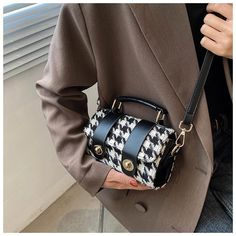 The EMES SHOP bag is detailed with a classy houndstooth print. Features a twist-lock closure. rectangle shape. top handle. and longer straps.MATERIAL:100% BrushedPoly BlendMEASUREMENTS:H" X W"X D" 19cm X 11cm X 7cm 7.5in X 4.3in X 2.8in Black Business Bag With Turn-lock Closure, Trendy Fall Box Bag For Office, Trendy Office Box Bag For Fall, Trendy Fall Office Box Bag, Rectangular Satchel With Hasp Closure For Fall, Trendy Business Satchel With Hasp Closure, Black Retro Shoulder Bag With Hasp Closure, Formal Fall Shoulder Bag With Handles, Retro Black Bag For Fall