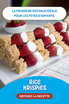 rice krispies with strawberries and marshmallows on them