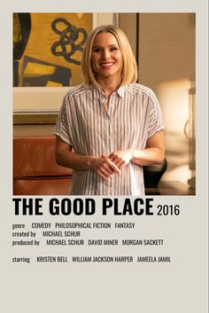 a woman standing in front of a painting with the words the good place on it