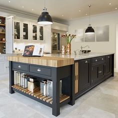 a large kitchen with an island in the middle