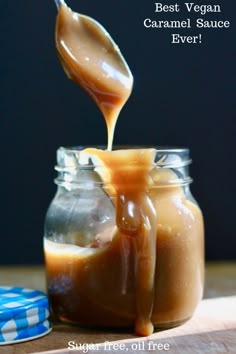 caramel sauce being poured into a glass jar