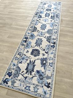 a blue and white rug on the floor