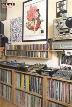 a room filled with lots of different types of records and audio equipment on shelves next to each other