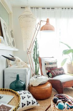 a living room filled with lots of furniture and decor