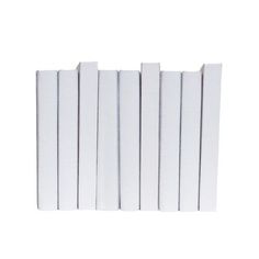 six white books lined up on top of each other in front of a white background