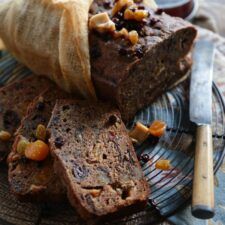 a plate topped with brownies covered in raisins