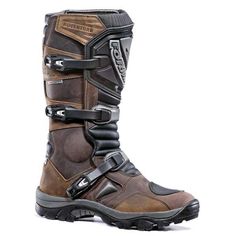 a pair of brown and black motorcycle boots