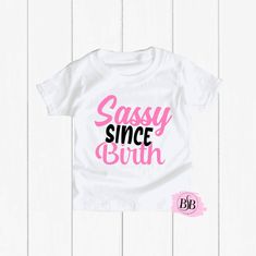 Sassy Since Birth, Funny Toddler Shirt, Funny Kids Shirt, Sassy Since Birth Shirt, Sassy Girl Shirt, Sassy Birthday Shirt, Sarcastic Shirt The design is adhered to the shirt with a premium professional heat press for optimum quality! I use TOP Quality Shirts. The shirts are VERY SOFT!! The shirts are true to size. Shirts ship out within 1 business days (MON-FRI) or less and take an additional 2-5 days to arrive. Each shirt is custom and made special just for your little one.  Subscribe to Our Yo Cute White Party Shirt, Fitted Letter Print Tops For Birthday, Fitted Short Sleeve Tops For Birthday, Fitted Cotton Shirt For Birthday, Fitted White Top For Birthday, Sassy Since Birth, Savage Shirt, Funny Baby Gifts, Funny Toddler Shirt