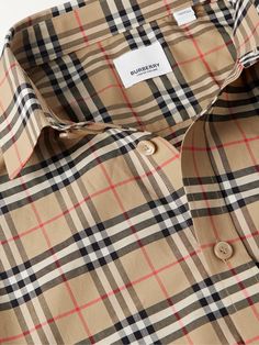 Burberry's shirt is patterned in its signature check, originally designed as the lining for the label's iconic trench coats. It's cut from stretch-cotton poplin and fastens with lustrous mother-of-pearl buttons. Leave yours untucked with dark jeans. Burberry Pattern, Tim Cook, Burberry Shirt, Godly Life, Cotton Poplin Shirt, Twill Shirt, Dark Jeans, Burberry Men, Poplin Shirt