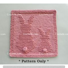 a pink knitted square with flowers on the front and bottom, in two rows