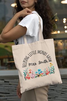 "PERFECT GIFT OCCASIONS: This tote bag will be the best gift for teachers on Teacher Appreciation Week, Back To School, First Day of School, 100 Days of School, Christmas Gift, and other occasions such as Birthday, End Of The Year Gift, or as a Nursery Bag. This 100% cotton bag comes in one size - 15\" x 16\"- perfect for everyday wear. While the canvas material will show off your designs in great colors, it's durable and will last for years. The bag features 20\" handles (made from the same can Best Gift For Teachers, Pre K Teacher, Teacher Tote Bag, Custom Teacher Gifts, Nursery Bag, Best Teacher Gifts, Teacher Tote, Thank You Teacher Gifts