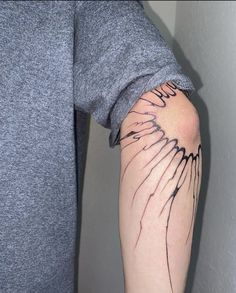 a person with a tattoo on their arm