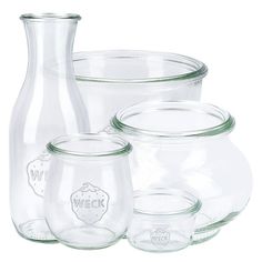 glass containers with lids are stacked on top of each other