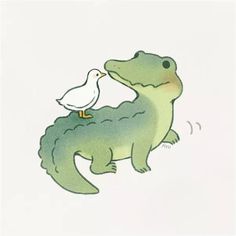 a white bird is standing on the back of a green alligator's head, with its beak in it's mouth