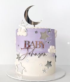 a baby shower cake decorated with stars and moon