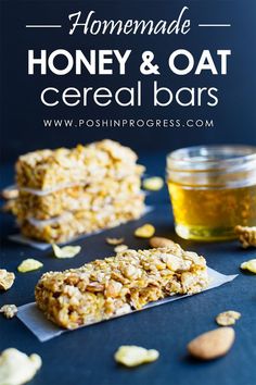 homemade honey and oat cereal bars on a blue surface with almonds around them