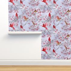 the wall paper has red birds on it