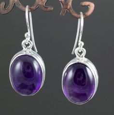 * Sterling Silver Amethyst Earrings. * These measure approximately 16mm X 12mm * These are standard 20g earrings. * You will receive the exact pair pictured. Nickel-free Round Purple Earrings, Classic Round Amethyst Earrings, Purple Round Pierced Earrings, Hypoallergenic Round Purple Earrings, Hypoallergenic Purple Round Earrings, Oval Amethyst Earrings For Gift, Fire Agate Ring, Chrysoprase Ring, Labradorite Earrings